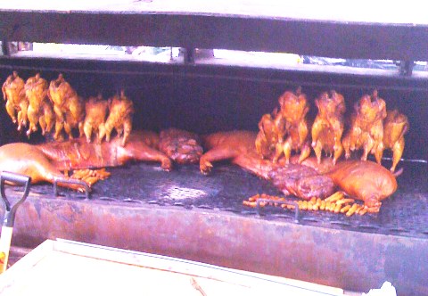 Chickens basting Pig Halfs