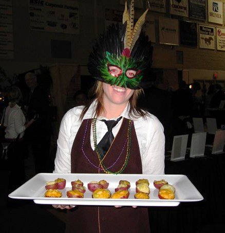 Kelsey Woodworth serves some New Potatoes stuffed with Crawfish!